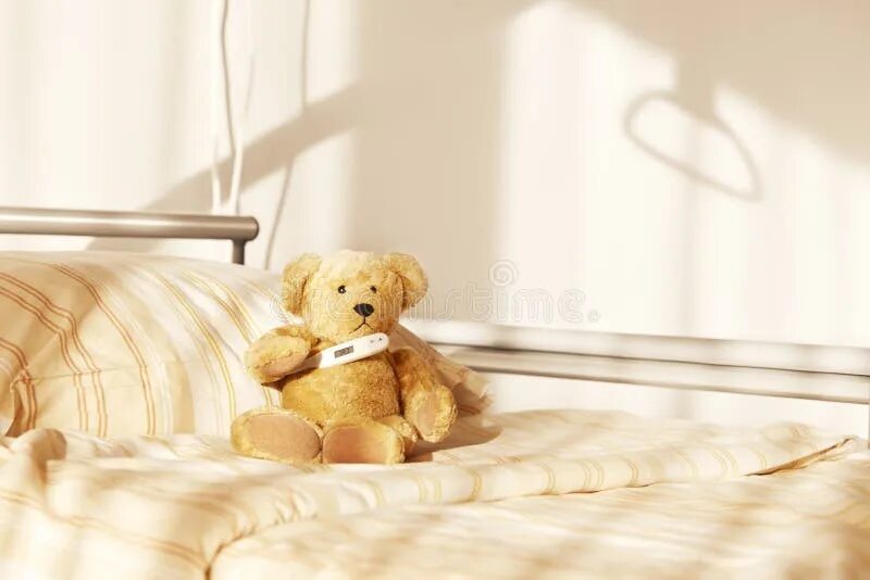 The teddy is on the bed