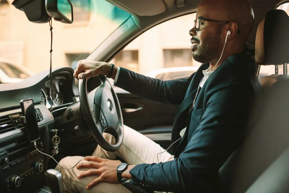 Businessman in a car Сток. Man with car. African man in Suit. Driving a car Music.