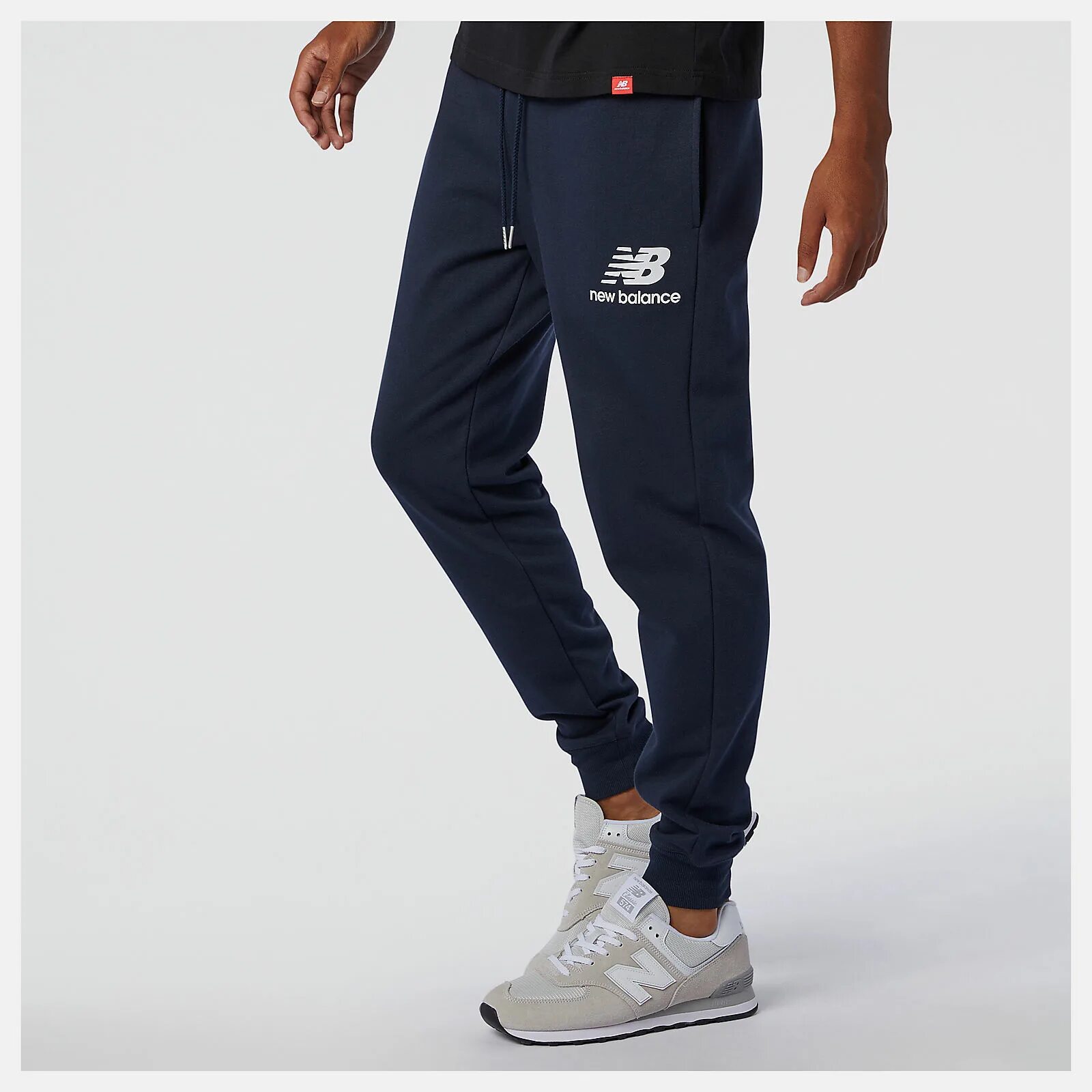 Штаны new balance. Брюки New Balance New Balance Essentials Stacked logo Sweatpants. New Balance men's NB Essentials Stacked logo Sweatpant. Брюки Essentials Stacked logo. New Balance Essentials Stacked logo шорты брюки мужские.