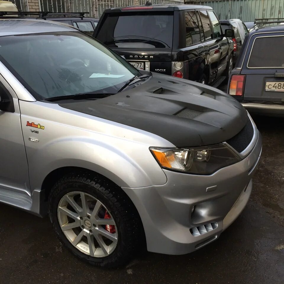 Капот аутлендер хл. Outlander XL капот HASEPRO. Mitsubishi Outlander XL Tuning. Митсубиси Аутлендер 3л 2007. Тонированный Mitsubishi Outlander XL.