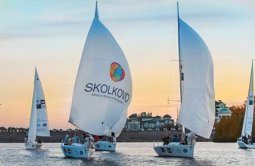 Team race sailing. Team sails. Sailboat with team mission. Team sails. Team sails.