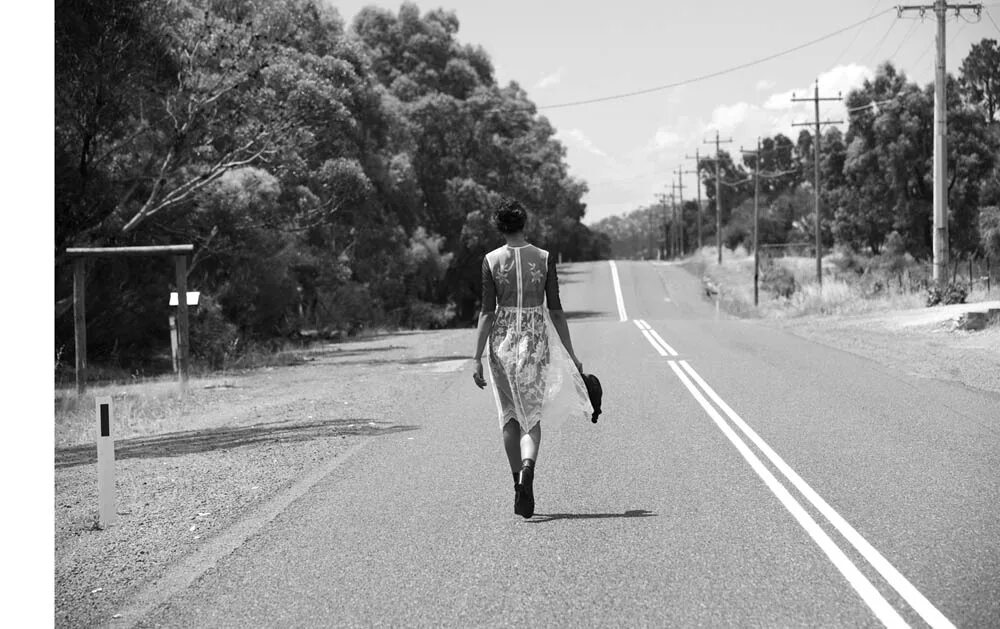 Longing for down. Photo of a young Black woman standing by the Roadside.