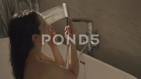 Perfect body girl enjoying shower in bat, Stock Video.