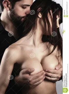 A guy touching boobs nude boobs.