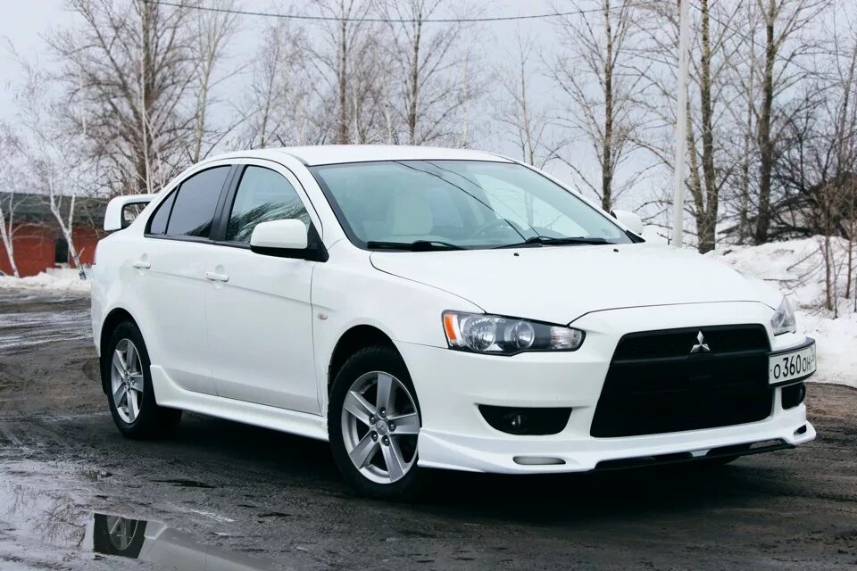 Mitsubishi lancer evolution x. Лансер в обвесе. Митсубиси лансер в обвесе. Лансер 10 в обвесе. Mitsubishi lancer 10 обвес.