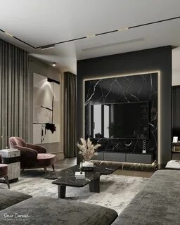 a modern living room with black and white walls, grey carpeted flooring and...