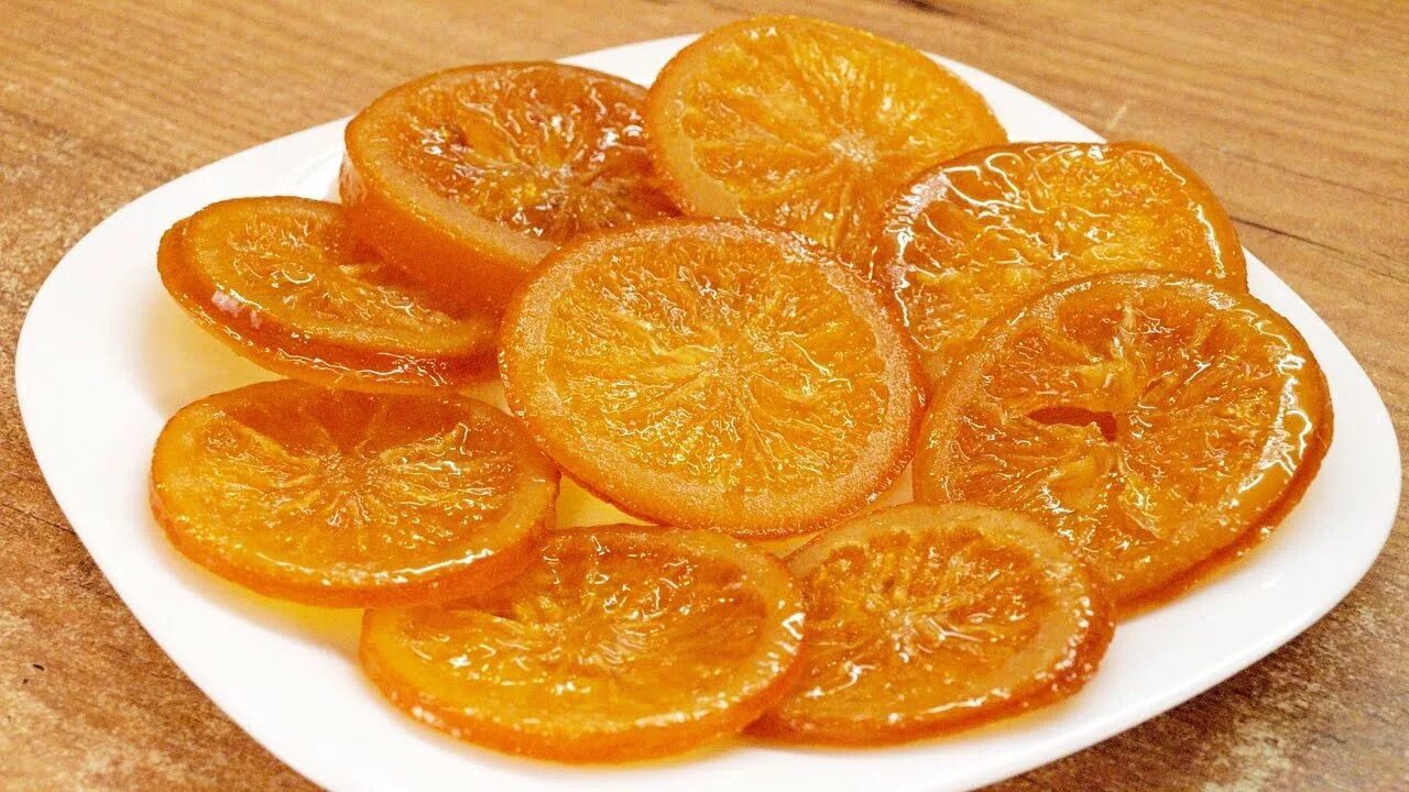 Цукаты из мандаринов. Карамелизированные дольки апельсина. цукаты апельсин дольки. ,цукаты из апельсин цукаты апельсина. карамелизировать апельсин.