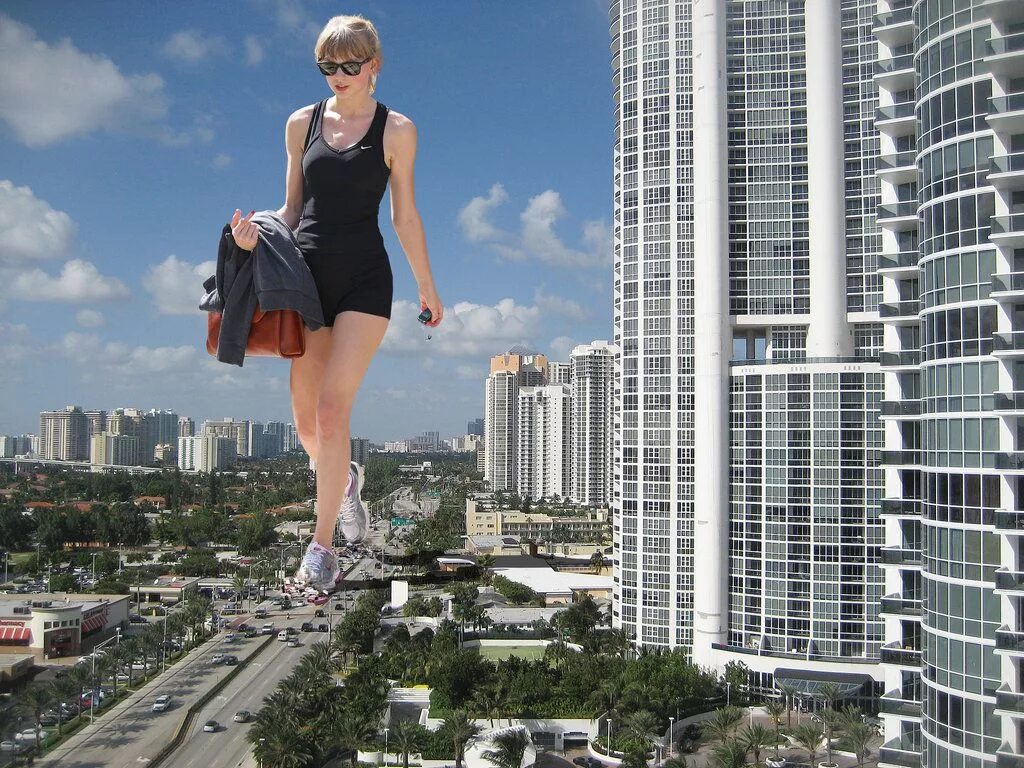 Дама высокие. Тейлор Свифт гигант. Тейлор Свифт giantess. Гигантская женщина. Женщины гиганты в городе.