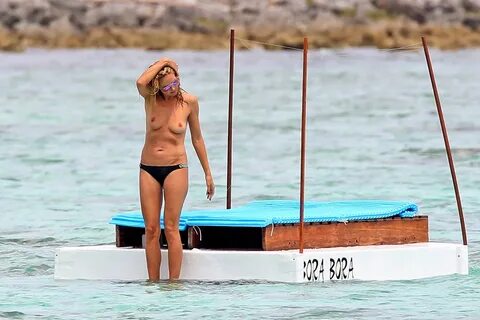 Heidi Klum Topless on the beach in Mexico.