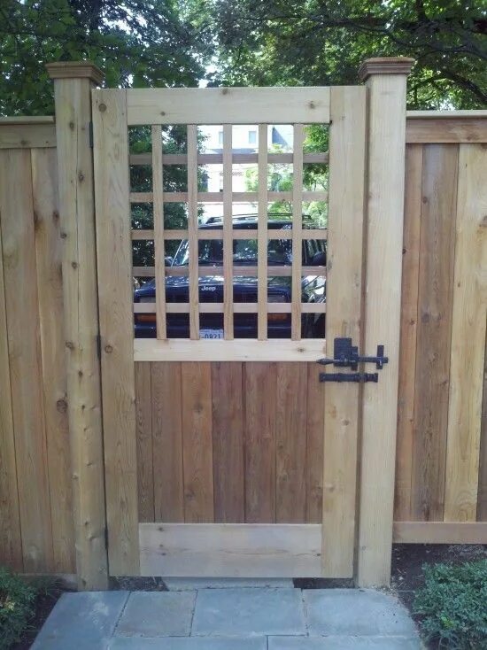 Wooden gate with keypad, installed by Frontier Fence Company, from behind Modern