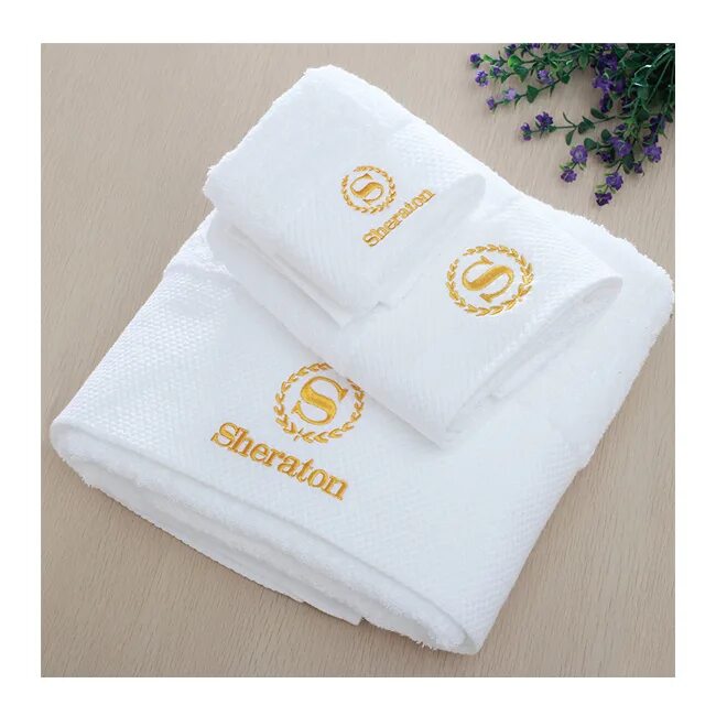 Вышивка логотипа на полотенце. Полотенца для отелей. Махровое полотенце с логотипом. Полотенце с логотипом отеля. Бренд полотенца