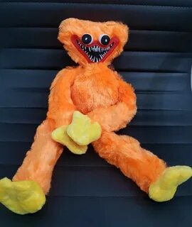 Оранжевая мягкая игрушка