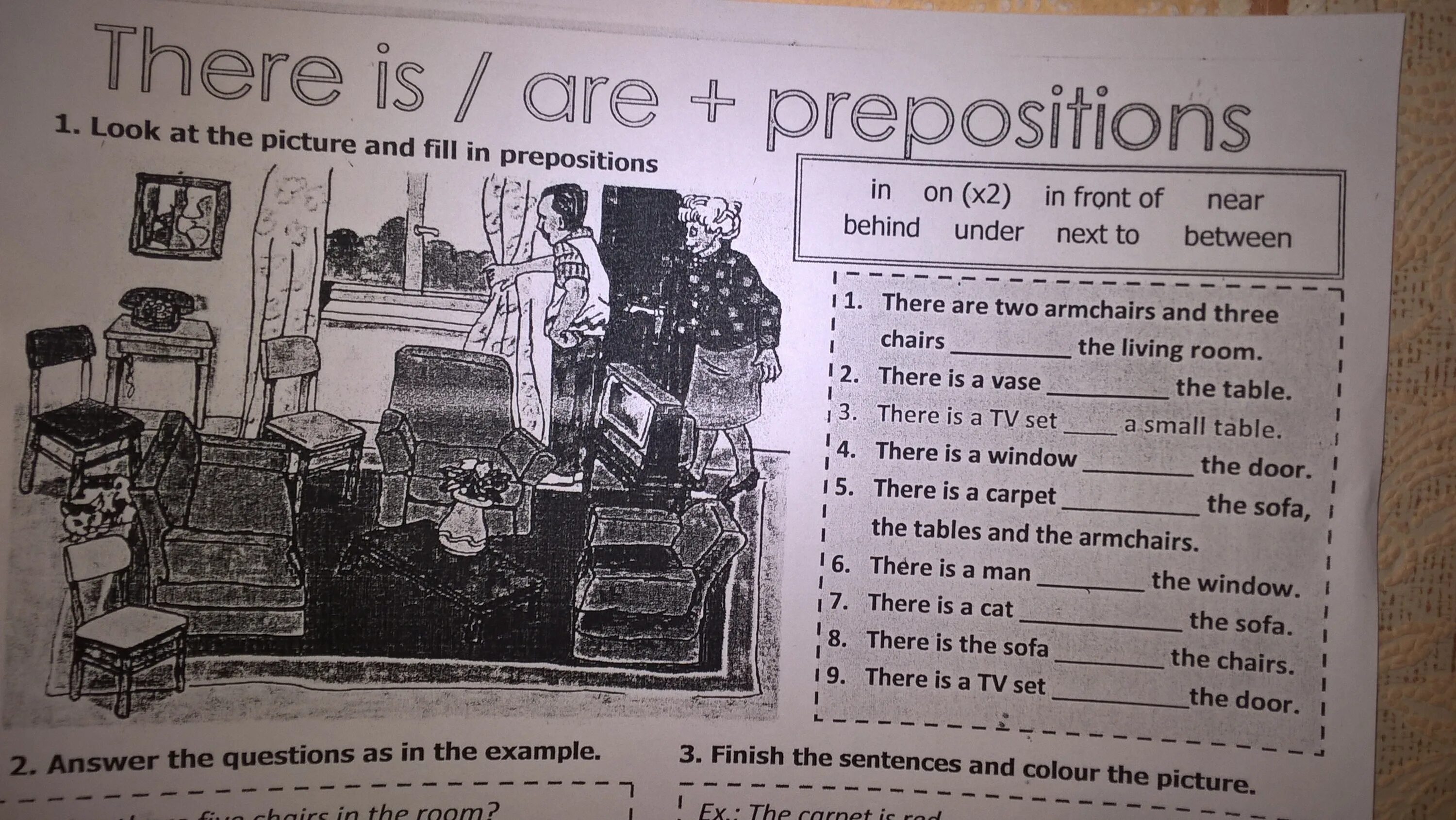 Answer the questions use ответы. Prepositions on in in front of behind. near next to. fill in the right prepositions. on in under next to in front of behind there is are.