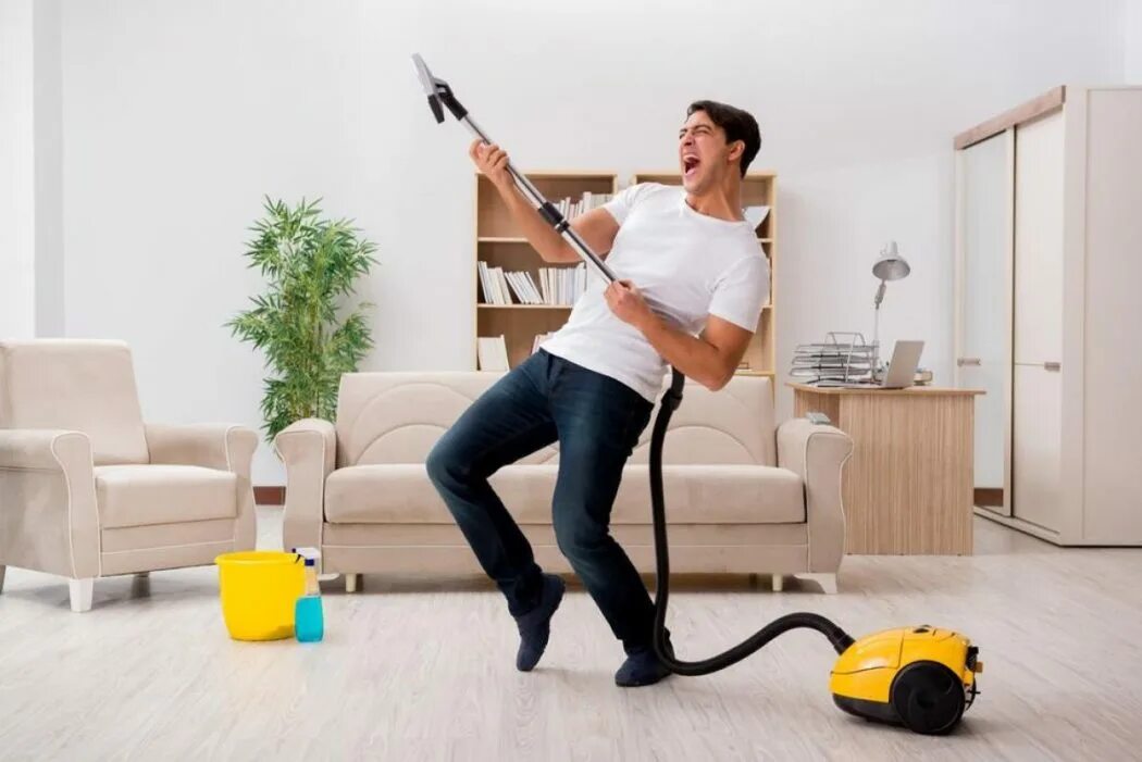 Home vacuum cleaner. Пылесос. Человек пылесос. Мужчина с пылесосом. Человек пылесосит.