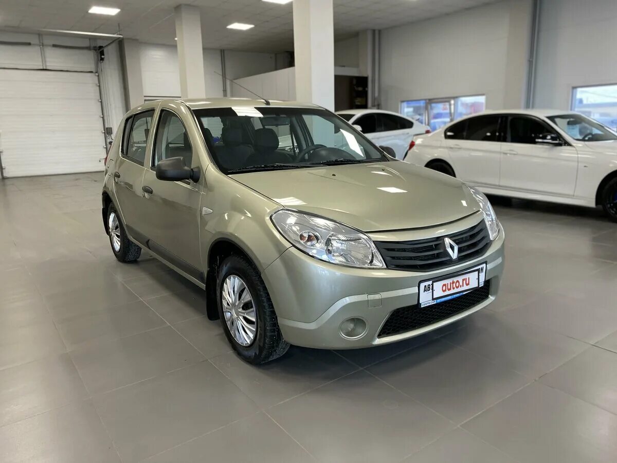 Renault sandero 2012. Рено Сандеро 2012г. Renault Sandero i 2012г. Сандеро 2012 год бежевый. Reno Sandero бежевый кремовый.