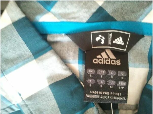 Как проверить подлинность адидас. Adidas бирка made in одежда. Adidas Neo бирка. Adidas Originals бирки.