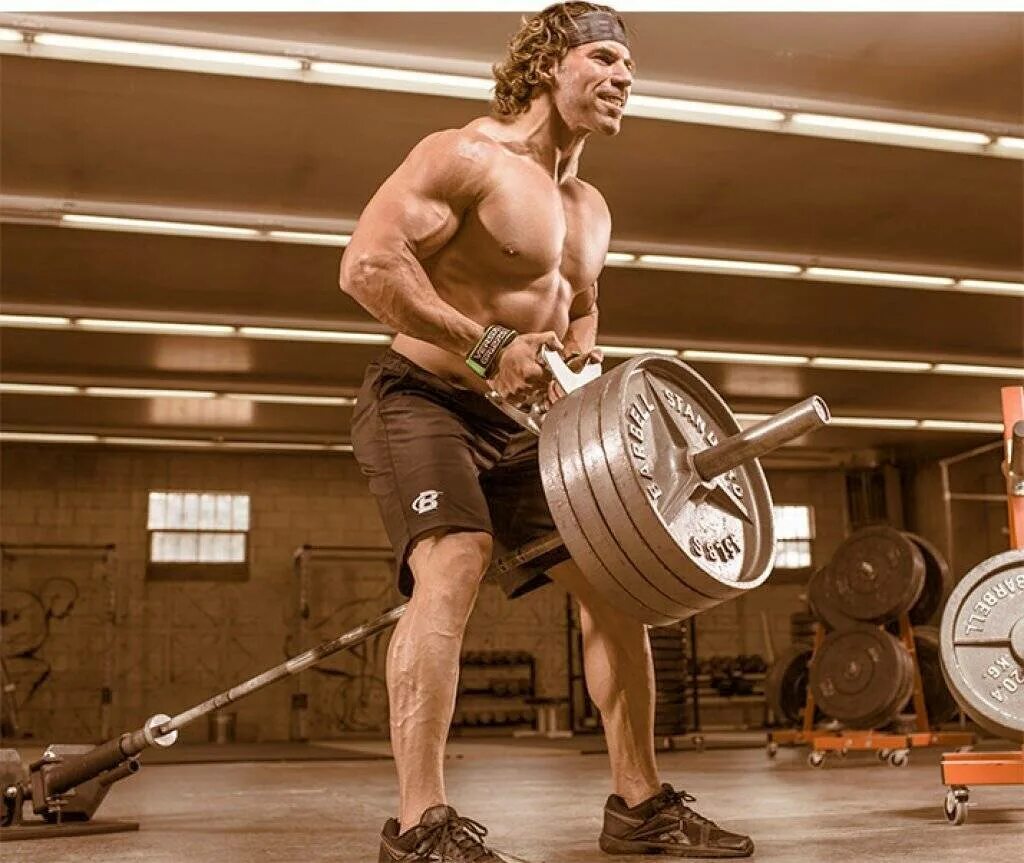 Тяга т грифа стоя. Тяга т-грифа в наклоне тренажер. Тяга т-грифа техника. Тяга т-грифа широким хватом. Тяга т грифа.