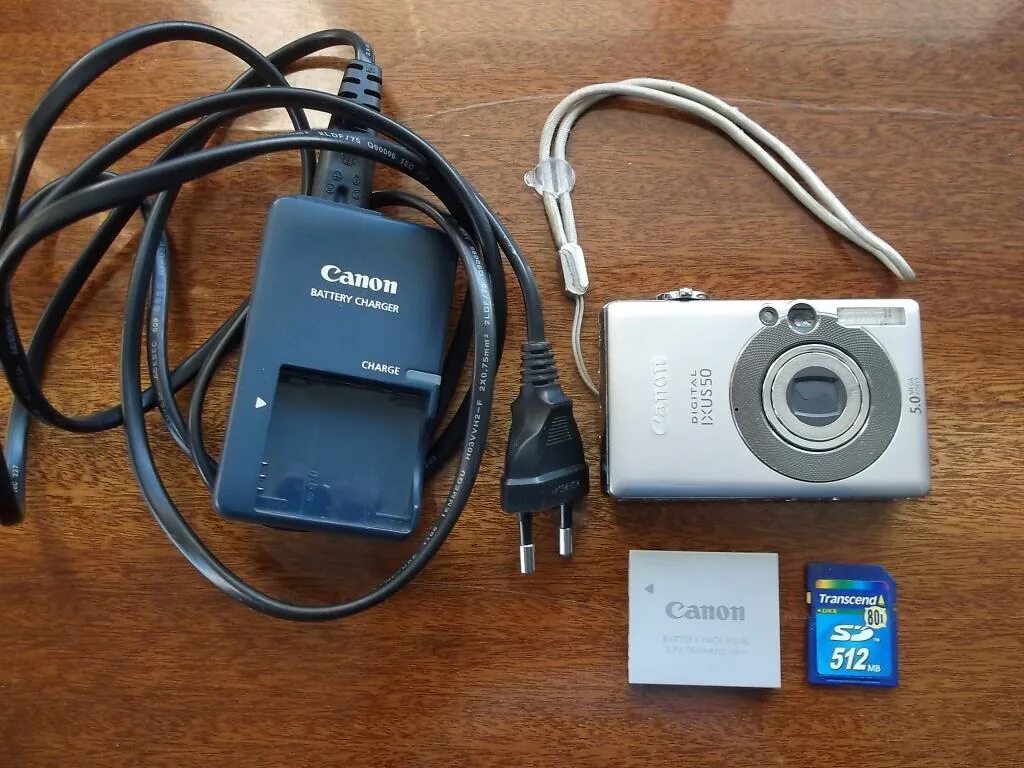 Как заряжать фотоаппарат. Canon ixus 50. фотоаппарат canon digital ixus 50. canon ixus зарядка. canon digital ixus 70 зарядка.