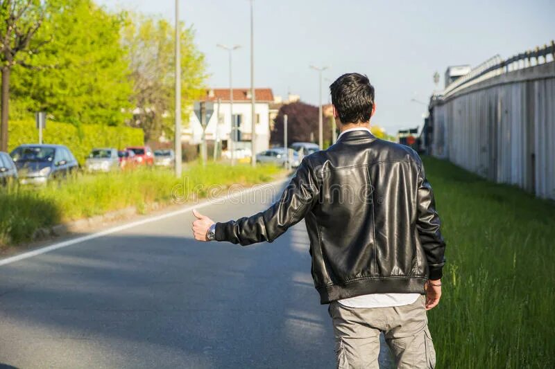 Человек на обочине картинки. Waiting for a car. A young man hitchhiking. Waiting for the man