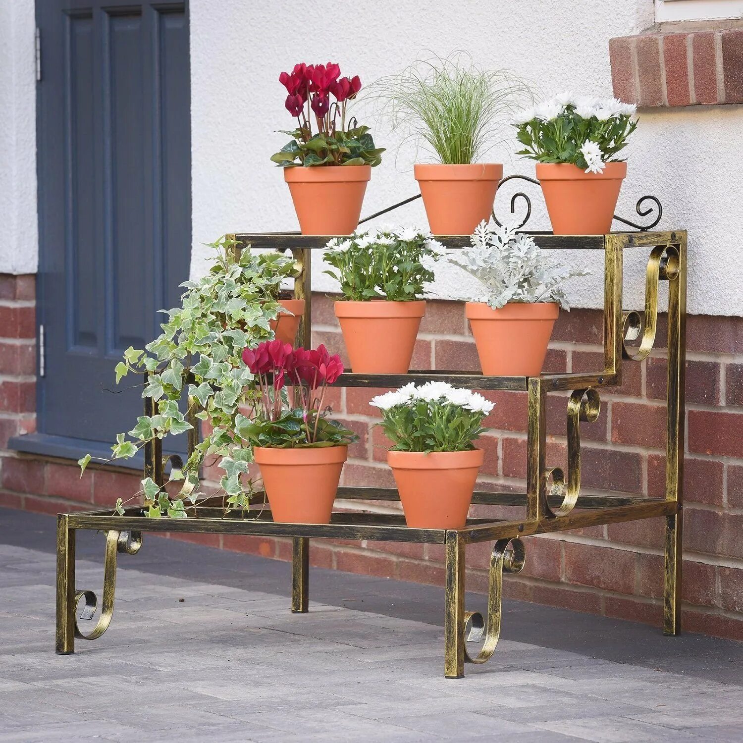 Подставки для цветов из металла. Уличные стойки для цветов из металла. Кованые подставки для цветов. Подставки для цветов в саду. Подставка под цветы уличная.