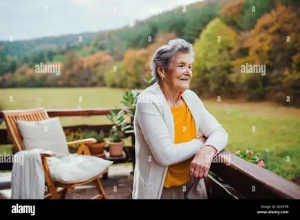 Elderly woman standing hi-res stock photography and images - Alamy