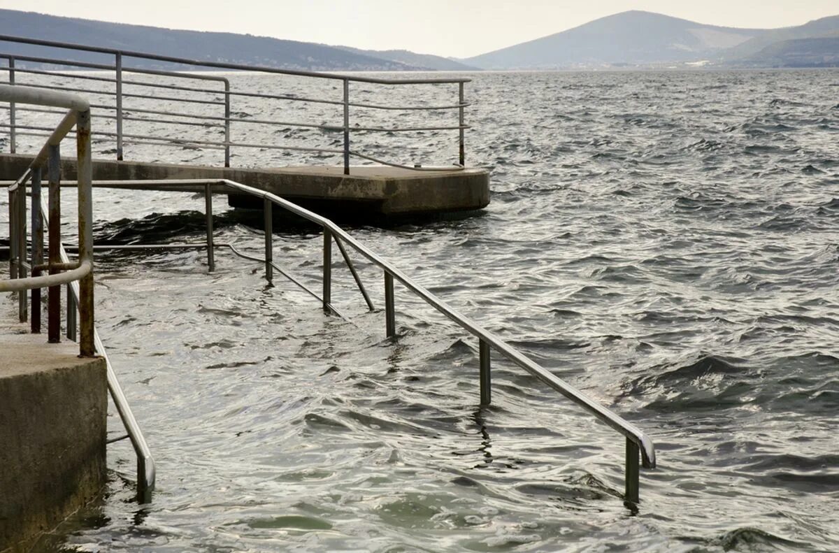 Поднятие уровня моря. Уровень воды в океане. повышение уровня воды в океане. глобальное потепление повышение уровня моря.