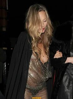 Kate Moss boob slip at Lets it all hang out partying in London.