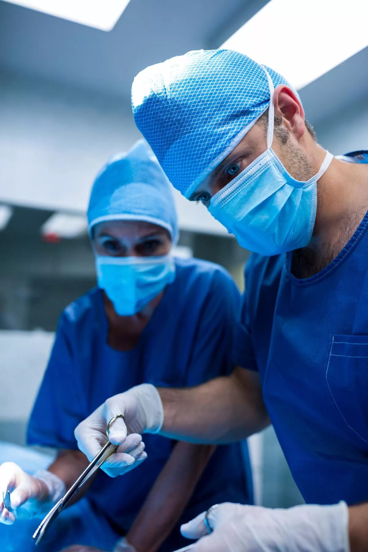 Surgeons performs operations