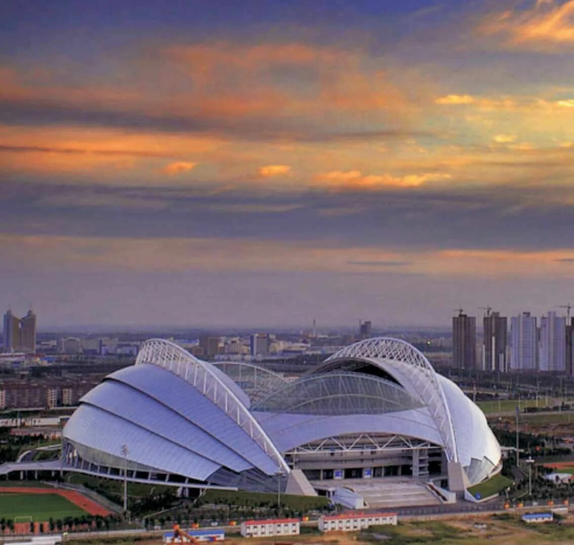 Center stadium. Шэньянский Олимпийский центр. Шэньян Олимпик Спортс центр Стэдиум. Шэньян стадион. Стадион олимпийского спортивного центра города Шэньян.