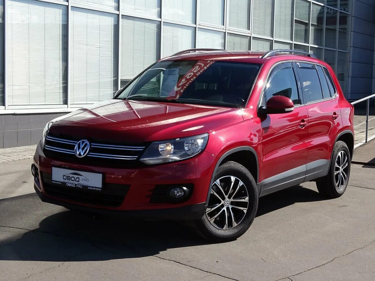 Volkswagen tiguan полный. Volkswagen Tiguan Red. Фольксваген Тигуан красный. Фольксваген Тигуан 2013 красный. VW Tiguan 1 Рестайлинг красный.