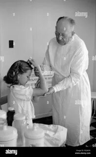 Young doctor old doctor Black and White Stock Photos & Images - Alamy