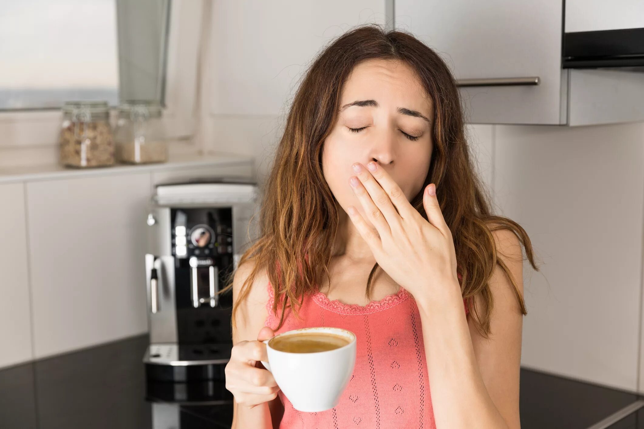 Drinking coffee she