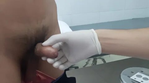 Naked circumcision medical examination, erect cock. 