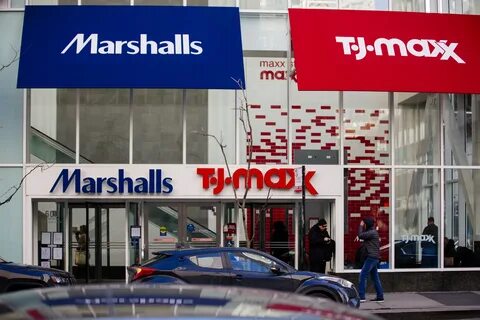 A pedestrian passes in front of a Marshalls and TJ Maxx store in Chicago, I...