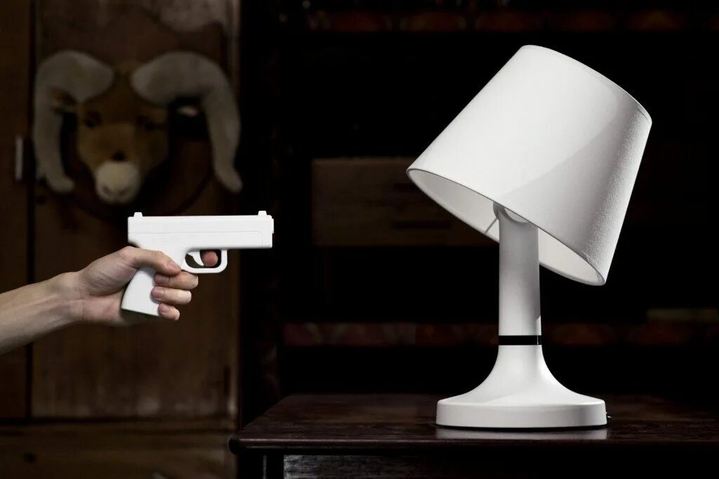 The lamp is on the desk
