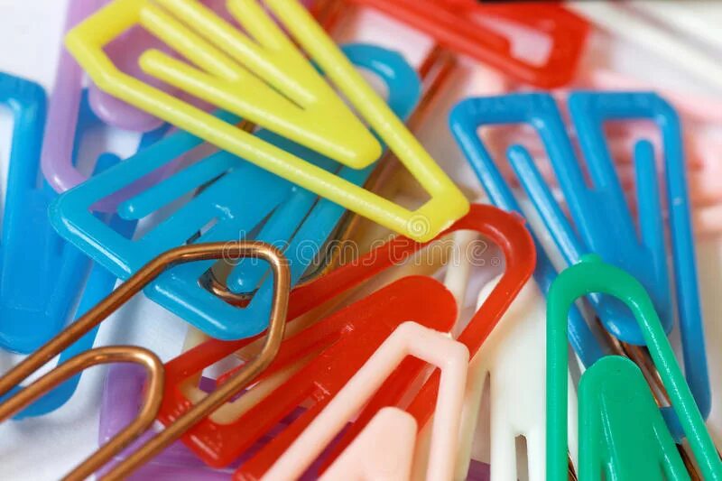 Lots of close. Paper clips in Plastic оранжевые.