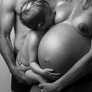 Nude breastfeeding mom