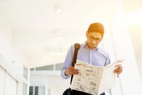 He is reading a newspaper now