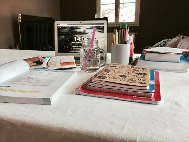 There is a desk in the study. Book desk. photos of scattered textbooks on the desk. studying tumblr.