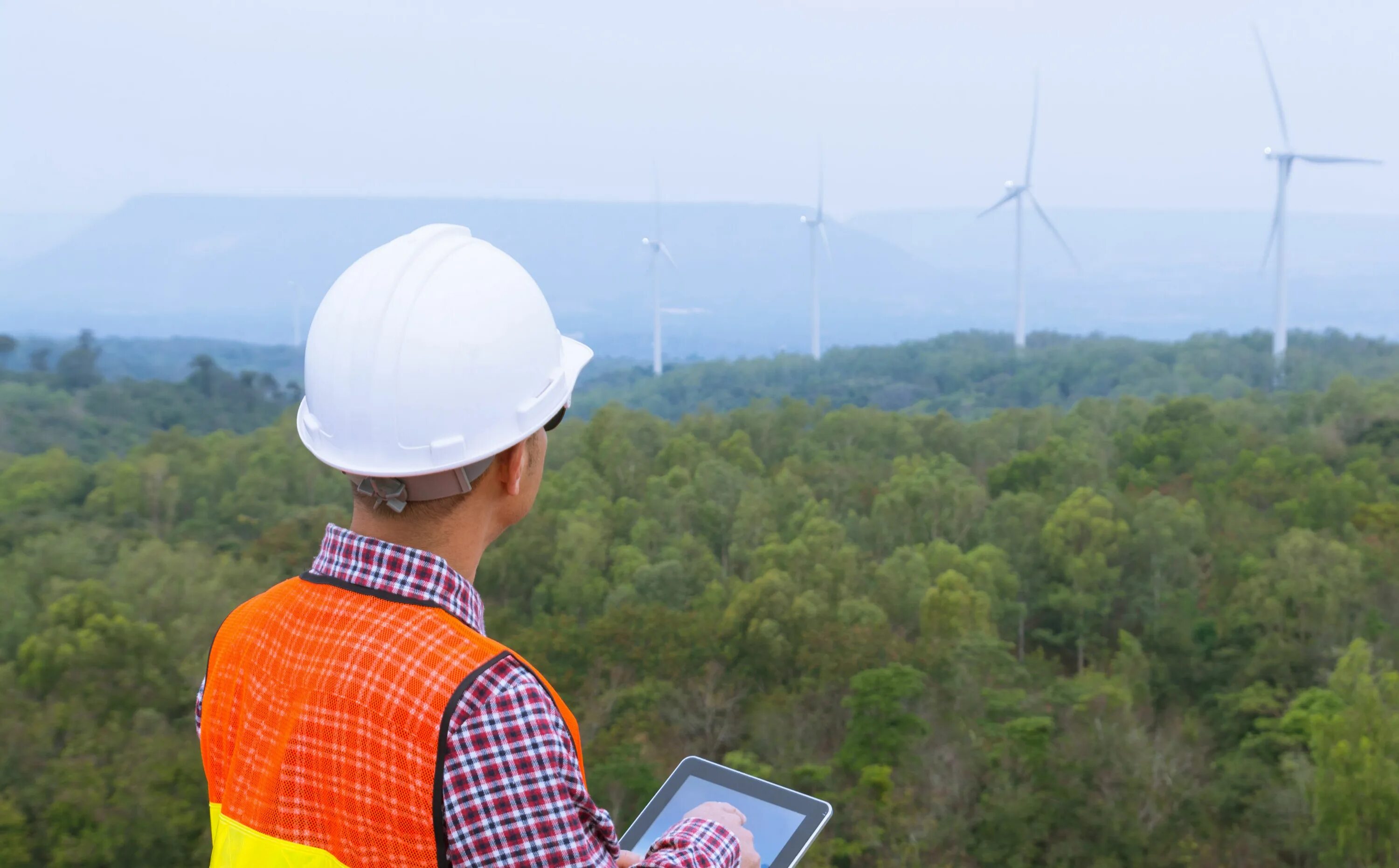 Field site. Field services engineer with smartphone toyota.