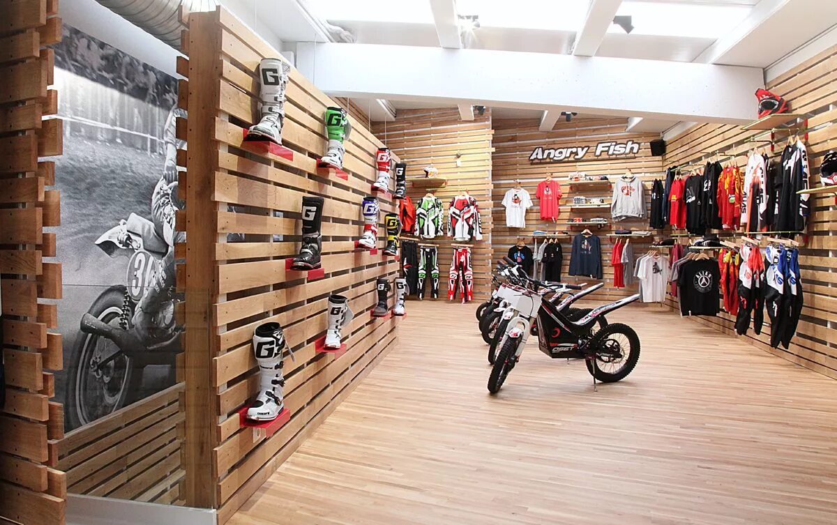 Our shop. Мото магазин интерьер. Мотоцикл в интерьере магазина. Мото магазин в интерьере магазина. Спортивный магазин в стиле лофт.