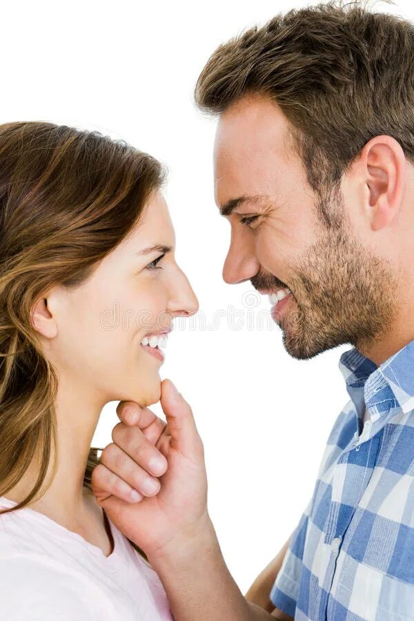 Looking at each other. Man and woman smiling at each other. Looking to each other and smiling. Young man pulling each other.