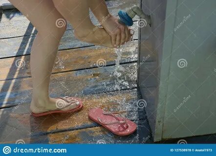 Download Girl Washes Her Feet Hands Under Water Little Shower Street Stock ...