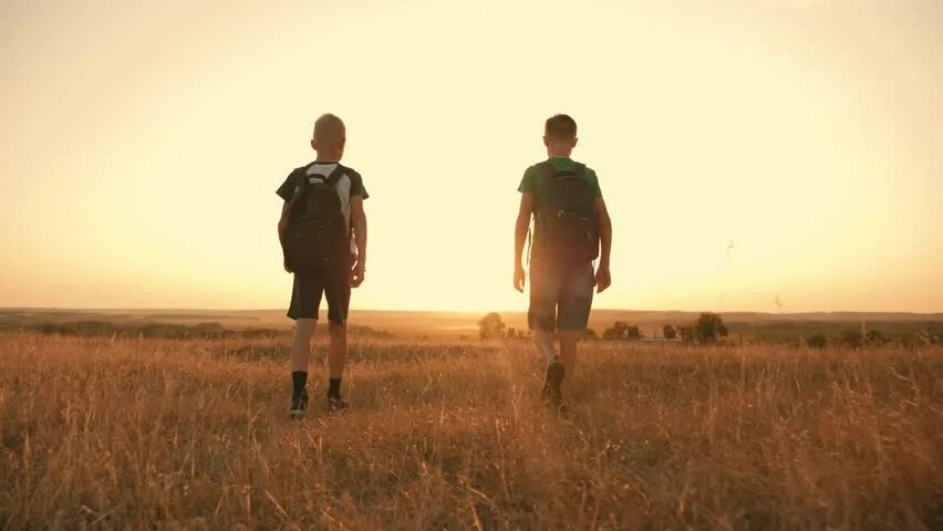 Journey boy. A boy Walking in the field. Journey traveller 2 boys. Two boy people natural. Boy Walking Soft & nakeg on public hikng Road.