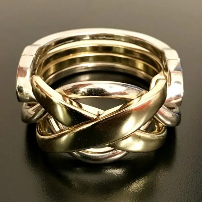 Кольцо головоломка как собрать. Головоломка hanayama ring. hanayama кольцо. кольцо головоломка из 4 колец. перстень головоломка.