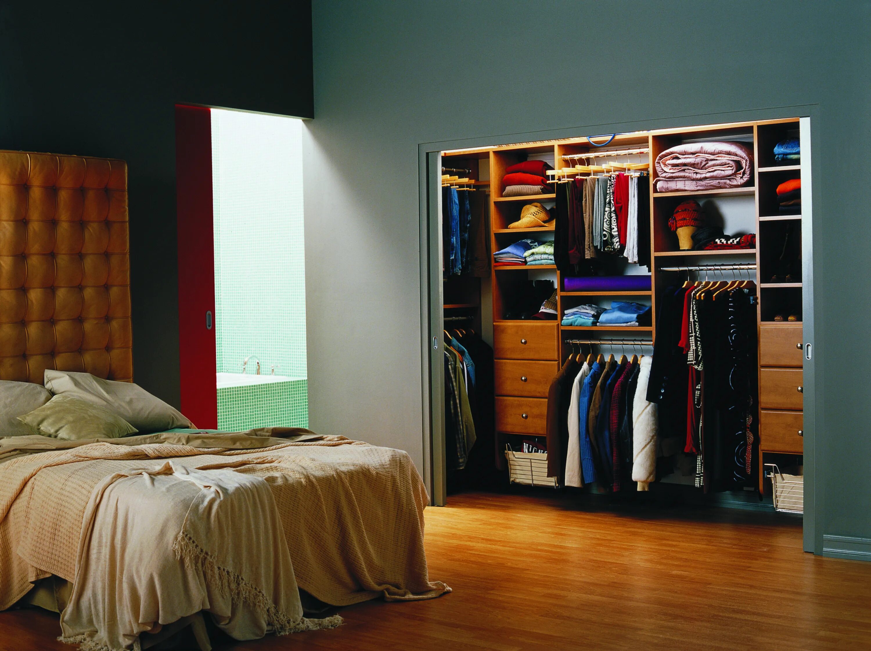 Next to the wardrobe
