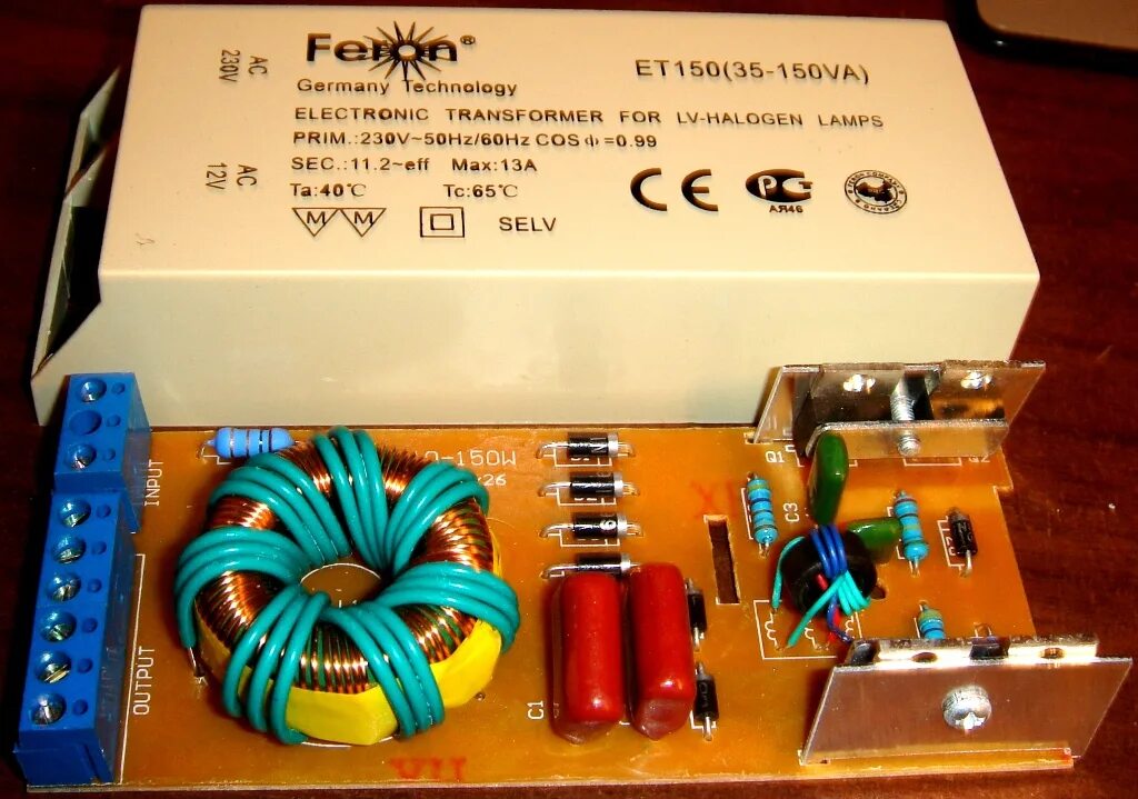 Электронные трансформаторы 12в. Трансформатор Feron et150 35-150va. Трансформаторный блок питания на 12 вольт. Трансформатор Feron et-150. Трансформатор 12 вольт 150 ватт.