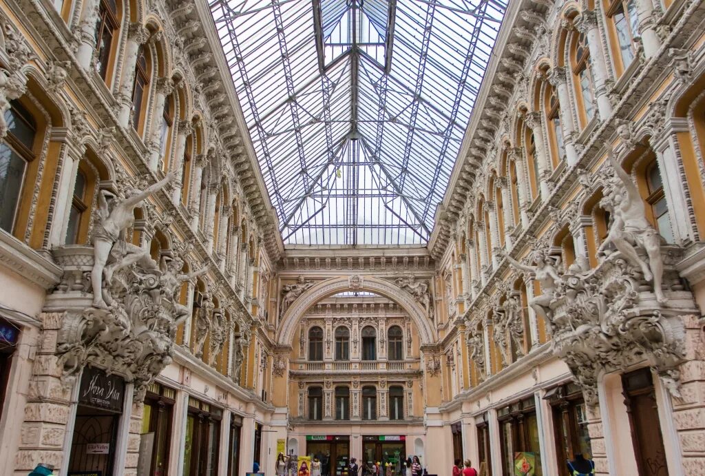 Пассаж на невском. Мелодичная скамейка пассажа где находится. Пассаж санкт-петербург. Торговый пассаж фасады. Мелодичная скамейка пассажа где находится.