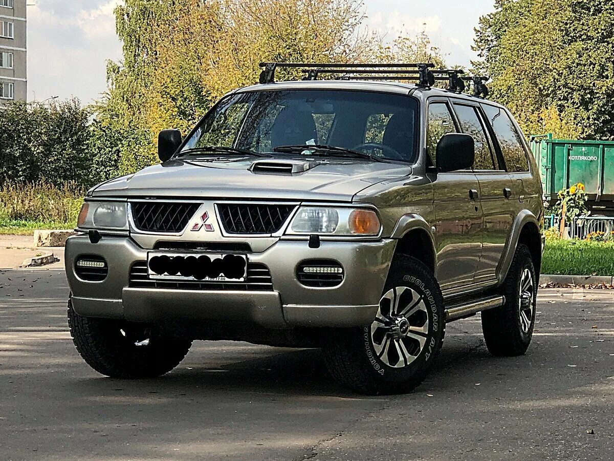 Pajero sport тюнинг. Mitsubishi Pajero Sport 1. Mitsubishi Pajero Sport 2006. Mitsubishi Pajero Sport 1 поколения. Митсубиши Паджеро спорт 1.