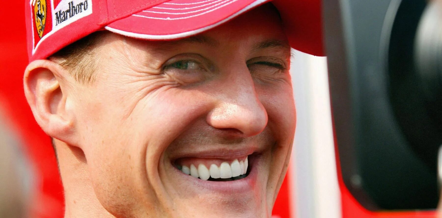 Михаэль Шумахер. Михаэль Шумахер улыбается. Михаэль Шумахер фото.